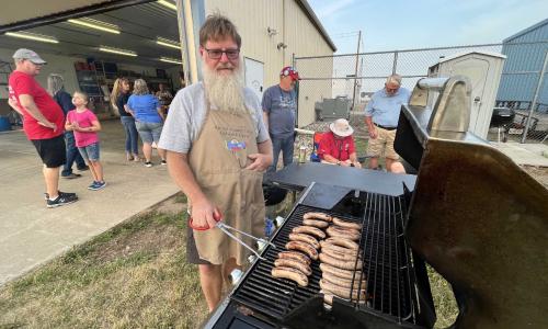 Phil cooking Boerewors for the Chapter 232 meeting